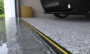 CGI render of ½" Garage Door Threshold waterproofing a garage with a car in it
