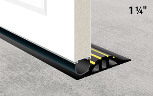 Drawing of the 1 ¼" garage door floor seal holding back rain and leaves