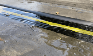 Garage door water barrier protecting a garage from 1 and ½ inches of rain